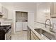 Efficient kitchen design includes granite counters, stainless appliances, laundry, and seamless kitchen access at 1450 Keys Crossing Ne Dr, Brookhaven, GA 30319