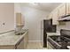 Kitchen featuring granite counters, stainless steel appliances, and neutral cabinetry at 1450 Keys Crossing Ne Dr, Brookhaven, GA 30319