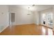 Spacious living room features hardwood floors, French doors and access to other areas of the home at 1450 Keys Crossing Ne Dr, Brookhaven, GA 30319