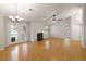 Bright living room boasts hardwood floors, a fireplace, and French doors for easy access to the outside at 1450 Keys Crossing Ne Dr, Brookhaven, GA 30319
