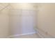 Walk-in closet featuring simple wire shelving and carpeted floor at 1450 Keys Crossing Ne Dr, Brookhaven, GA 30319