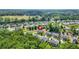 Aerial view of house in a lovely residential neighborhood surrounded by trees and well manicured lawns at 200 Cherokee Reserve Cir, Canton, GA 30115
