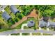 An aerial view reveals a home with solar panels, a fenced yard, and a beautifully landscaped lawn at 200 Cherokee Reserve Cir, Canton, GA 30115