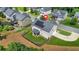 A birds-eye view of a property that features solar panels, a fenced in backyard, and manicured lawn at 200 Cherokee Reserve Cir, Canton, GA 30115