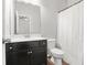 Bright and clean bathroom featuring a vanity with a sink and a toilet at 200 Cherokee Reserve Cir, Canton, GA 30115