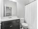 Bathroom features a modern vanity and a shower with a curtain at 200 Cherokee Reserve Cir, Canton, GA 30115