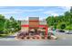 Dunkin' storefront featuring a charming patio, modern design, and a welcoming atmosphere for customers at 200 Cherokee Reserve Cir, Canton, GA 30115