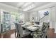 Bright dining room with stylish chairs, contemporary lighting, and decorative accents at 200 Cherokee Reserve Cir, Canton, GA 30115