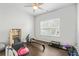 Home gym featuring a ceiling fan and big windows for natural light at 200 Cherokee Reserve Cir, Canton, GA 30115
