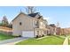 Charming two-story home with a well-maintained lawn and a one-car attached garage at 200 Cherokee Reserve Cir, Canton, GA 30115