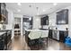 Spacious kitchen with stainless steel appliances, dark wood cabinets, granite counters, and kitchen island at 200 Cherokee Reserve Cir, Canton, GA 30115