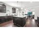 Spacious kitchen featuring dark cabinets, granite countertops, a center island, and open layout at 200 Cherokee Reserve Cir, Canton, GA 30115