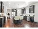 Modern kitchen with stainless steel appliances, dark cabinets, granite countertops, and a center island at 200 Cherokee Reserve Cir, Canton, GA 30115
