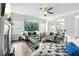 Bright living room with hardwood floors, fireplace, large windows, stylish furniture and elegant decor at 200 Cherokee Reserve Cir, Canton, GA 30115