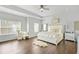 Spacious main bedroom with tray ceilings, hardwood floors, and plenty of natural light at 200 Cherokee Reserve Cir, Canton, GA 30115