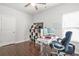 Comfortable home office setup with hardwood flooring, and modern desk at 200 Cherokee Reserve Cir, Canton, GA 30115