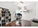 A home office space with hardwood flooring and a ceiling fan at 200 Cherokee Reserve Cir, Canton, GA 30115