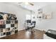 Bright office features hardwood floors, a ceiling fan, and large desk and shelving at 200 Cherokee Reserve Cir, Canton, GA 30115