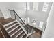 Bright staircase features wood treads, iron railings, and large windows at 200 Cherokee Reserve Cir, Canton, GA 30115