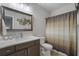 Charming bathroom with a large mirror, decor, shower curtain and vanity at 421 Retreat Ln, Canton, GA 30114