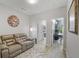 Cozy living space featuring a comfortable couch, accent rug and visible office and laundry spaces at 421 Retreat Ln, Canton, GA 30114
