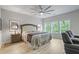 Serene main bedroom with large windows, hardwood floors, and a seating area for relaxation at 421 Retreat Ln, Canton, GA 30114