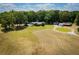 Large property with a well-maintained lawn, mature trees, and a private in-ground pool at 1050 Denton Rd, Douglasville, GA 30134