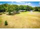 Expansive property with a well-maintained lawn, mature trees, and a charming single-story home at 1050 Denton Rd, Douglasville, GA 30134