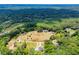 Aerial view of the private estate surrounded by lush, mature trees at 1050 Denton Rd, Douglasville, GA 30134