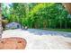 An expansive backyard with a concrete patio and dining area is perfect for outdoor gatherings at 1050 Denton Rd, Douglasville, GA 30134