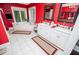Red bathroom with dual sink vanity and a corner soaking tub with backyard views at 1050 Denton Rd, Douglasville, GA 30134