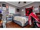 Cozy bedroom features hardwood floors and a comfortable bed at 1050 Denton Rd, Douglasville, GA 30134