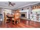 Charming dining area with a stone fireplace, hardwood floors, and cozy decor at 1050 Denton Rd, Douglasville, GA 30134