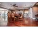 Elegant dining room featuring a stone fireplace, detailed woodwork, and hardwood floors at 1050 Denton Rd, Douglasville, GA 30134