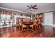 Formal dining room with hardwood floors, elegant furnishings, and a decorative fireplace at 1050 Denton Rd, Douglasville, GA 30134