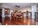 Spacious dining room with an ornate wooden table, hardwood floors, and an adjacent kitchen at 1050 Denton Rd, Douglasville, GA 30134