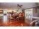 Open dining area with hardwood floors, ornate table, and access to the adjacent kitchen and living spaces at 1050 Denton Rd, Douglasville, GA 30134