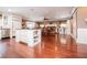 Open-concept living space featuring a kitchen island, dining area, and hardwood floors at 1050 Denton Rd, Douglasville, GA 30134