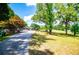 Long driveway leads to this house with lush greenery and serene views surrounding the property at 1050 Denton Rd, Douglasville, GA 30134