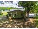Rear exterior view of the home with a fenced yard and patio area, perfect for outdoor enjoyment at 1050 Denton Rd, Douglasville, GA 30134