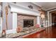 Close-up of a stone fireplace with a decorative mantle and hearth at 1050 Denton Rd, Douglasville, GA 30134