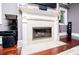 Living area featuring a classic white fireplace with a marble hearth and surround at 1050 Denton Rd, Douglasville, GA 30134