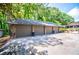 Spacious three car garage with stone accents and a wide driveway for plenty of parking at 1050 Denton Rd, Douglasville, GA 30134