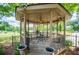 Charming gazebo with seating area, perfect for relaxing and enjoying the serene outdoor views at 1050 Denton Rd, Douglasville, GA 30134