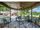 Relax in this gazebo with a ceiling fan with a view of the pool and lush backyard at 1050 Denton Rd, Douglasville, GA 30134