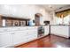 Well-appointed kitchen with granite countertops, stainless steel appliances, and beautiful white cabinets at 1050 Denton Rd, Douglasville, GA 30134