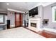 Spacious living room with hardwood floors and a fireplace, perfect for entertaining at 1050 Denton Rd, Douglasville, GA 30134