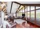 Spacious living room with hardwood floors, a wall of windows, and vaulted ceilings at 1050 Denton Rd, Douglasville, GA 30134
