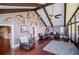 Cozy living room featuring high ceilings, hardwood floors, and decorative wall mounts at 1050 Denton Rd, Douglasville, GA 30134