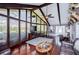 Spacious living room with high ceilings, hardwood floors, and a wall of windows at 1050 Denton Rd, Douglasville, GA 30134